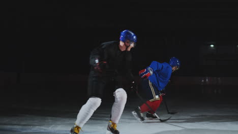 2-hockey-players-fighting-for-puck,-legs,-skates-close-view